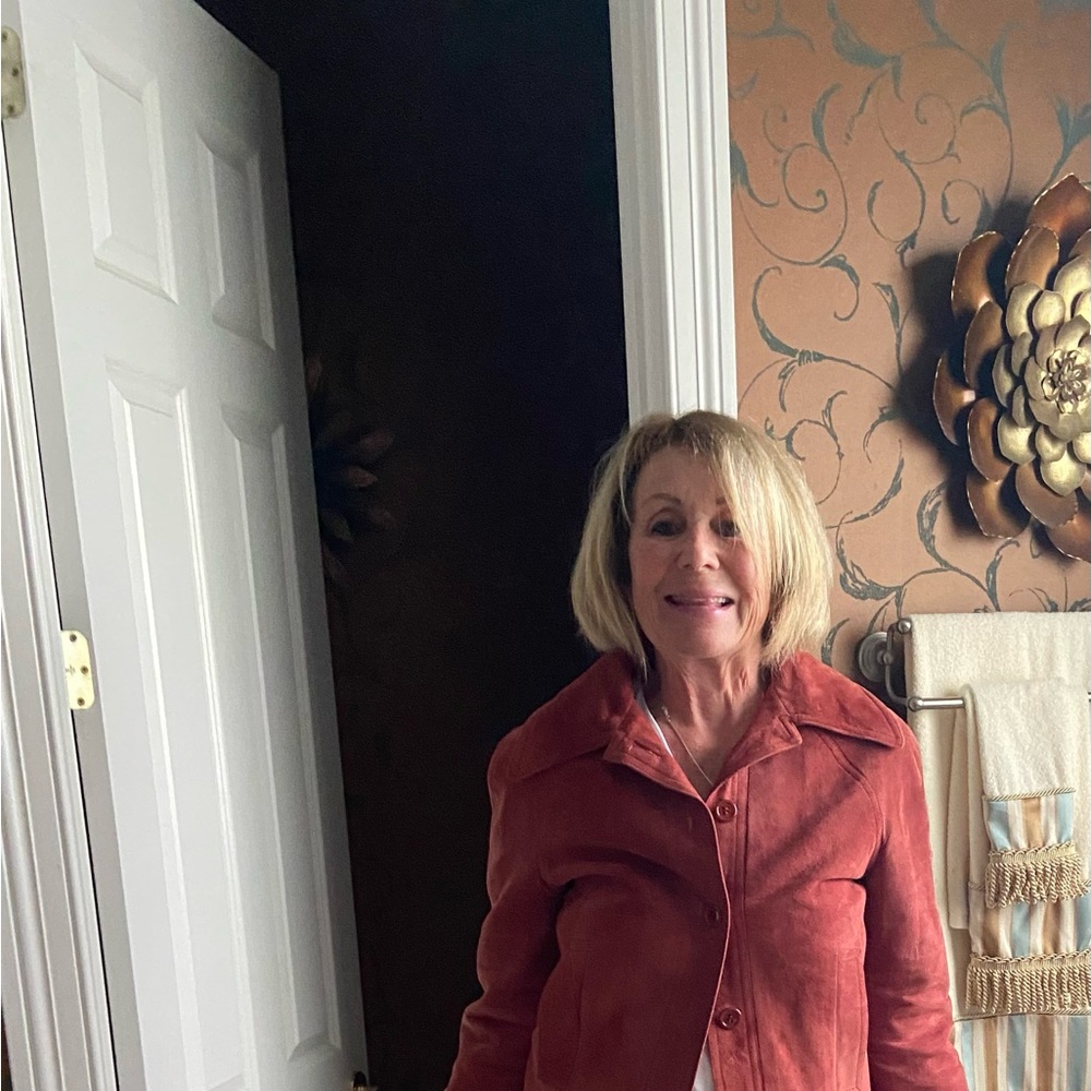 A rust colored suede jacket. Nearly new! Beautiful suede!